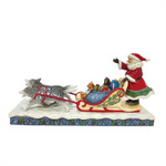 JIM SHORE DOG SLEDDING SANTA FIGURINE